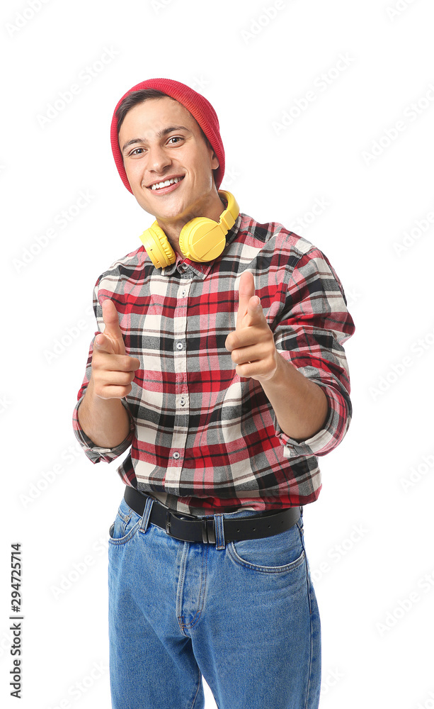 Portrait of handsome young man with headphones on white background