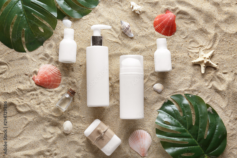 Cosmetics for personal hygiene on beach sand