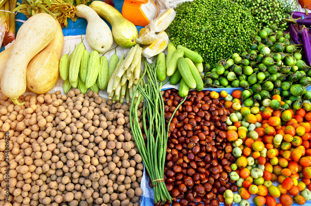 Potatoes, Dog fruit, Jengkol, Tomato, Eggplant, Bitter melon display on traditional local market.