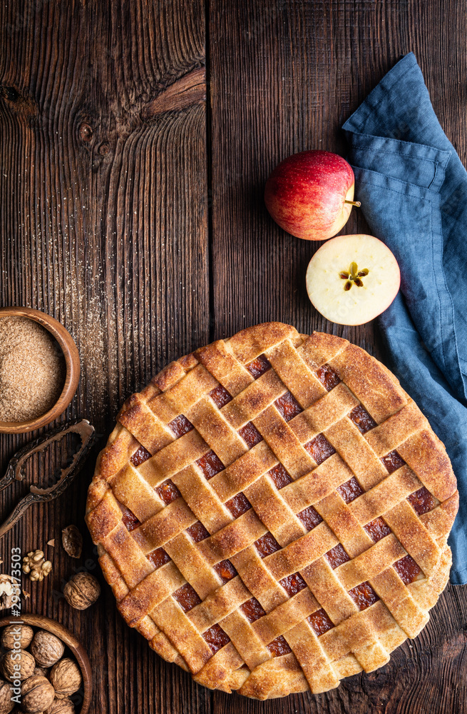 Homemade dessert, old fashioned lattice crust pie with grated apple and walnut filling, sprinkled wi