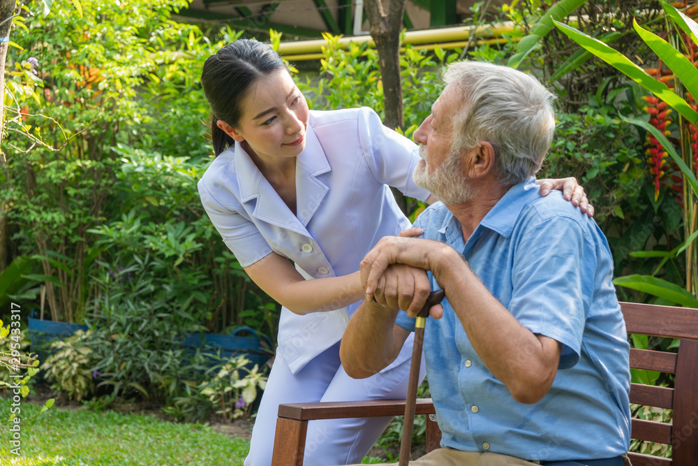 Young nurse take care senior man at home, Senior man happniess and smiling with nurse, Health care c