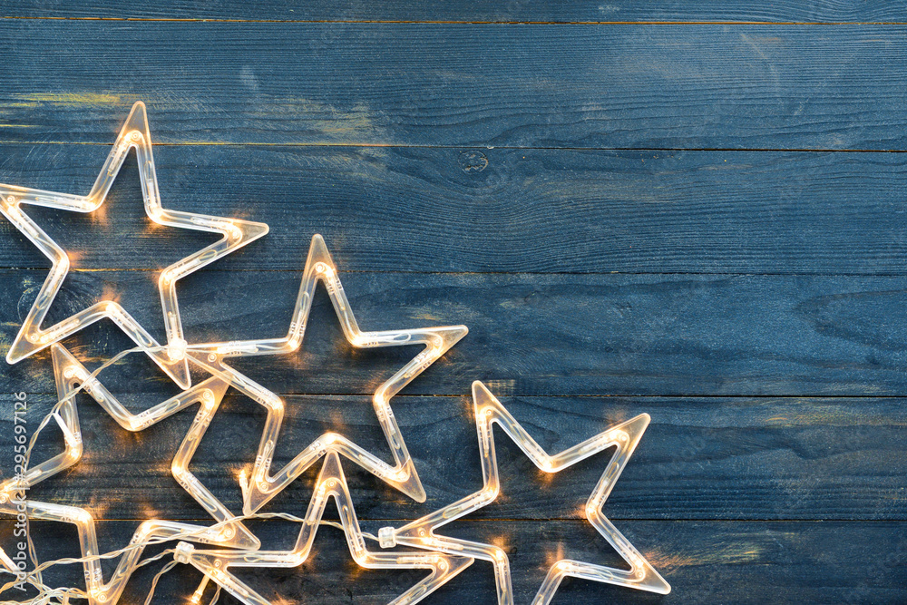 Beautiful glowing garland on dark wooden background