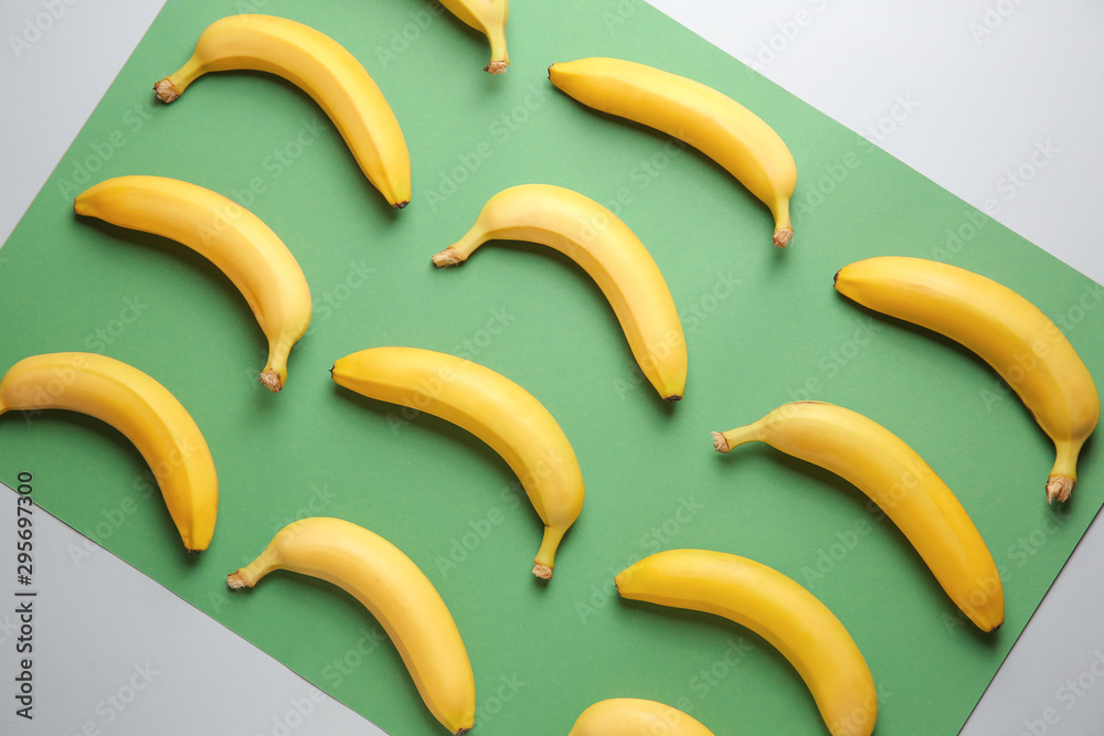 Ripe bananas on color background