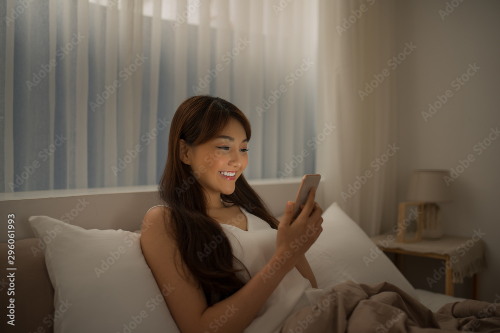 Young woman read message on cellphone