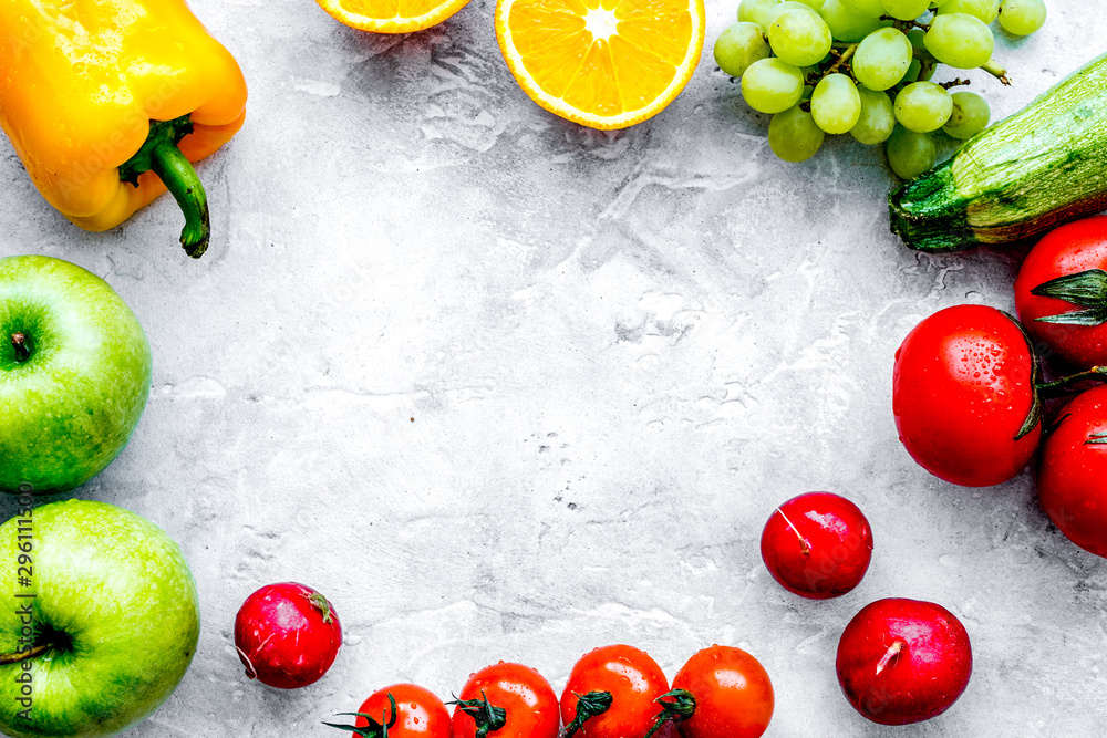 fruits and vegetables for healthy dinner on stone background top view mock up