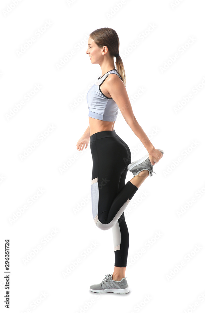 Sporty young woman training against white background