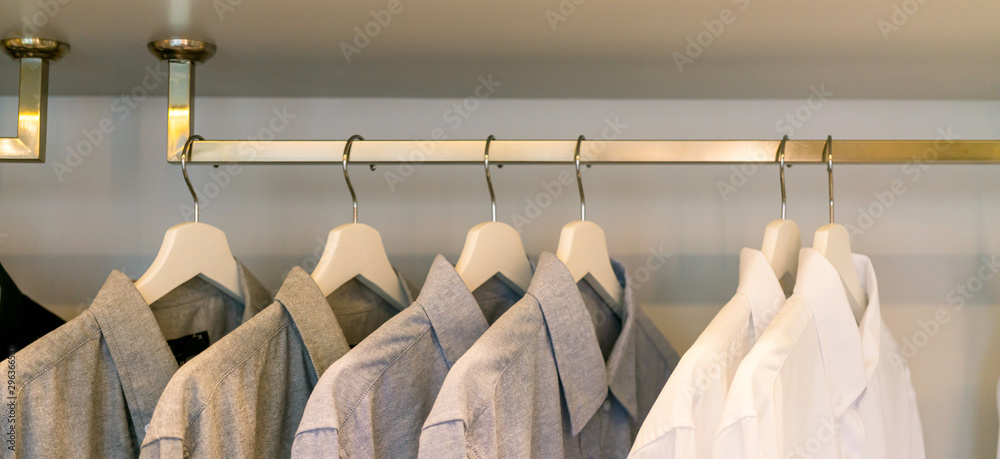 close up hanger closet with shirt uniform hanging home interior design