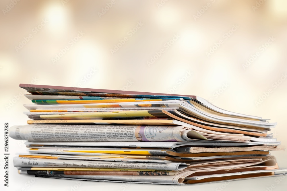 Stack of magazines on white background