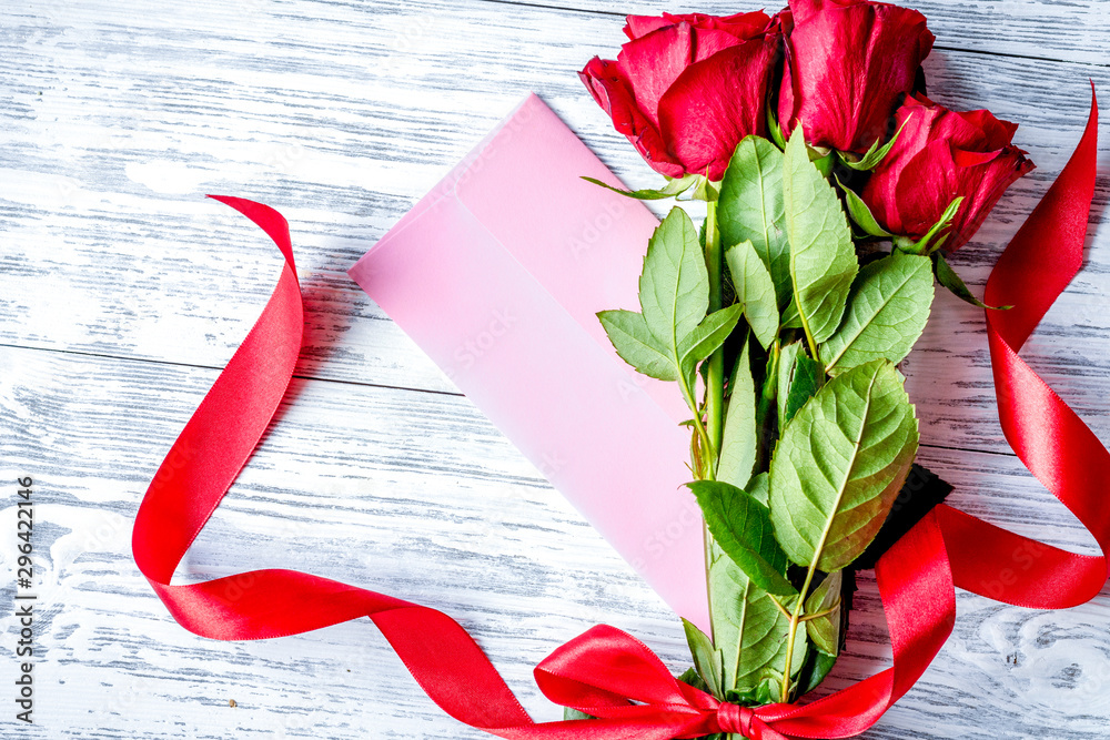 concept Valentines Day with flower wooden background top view