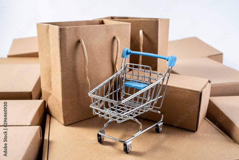 Bunch of express box paper boxes and shopping cart on white background