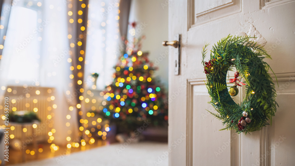 Christmas atmosphere at home with a light chain and Christmas tree