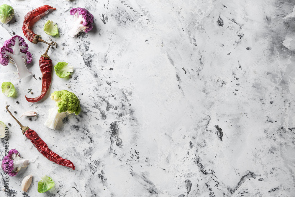 Chili pepper with different cabbage on light background