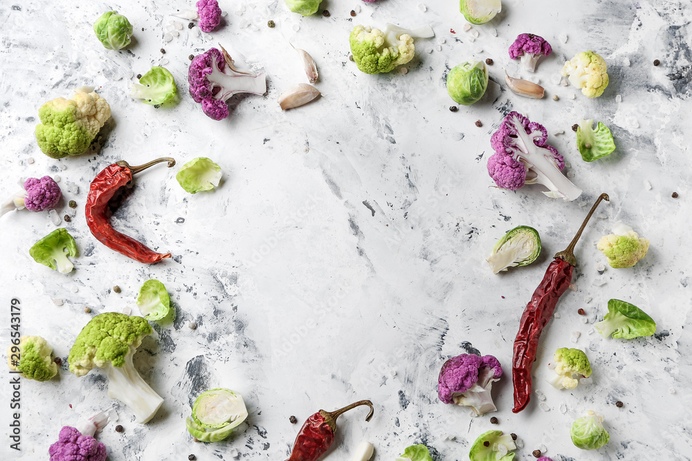 Frame made of chili pepper with different cabbage on light background