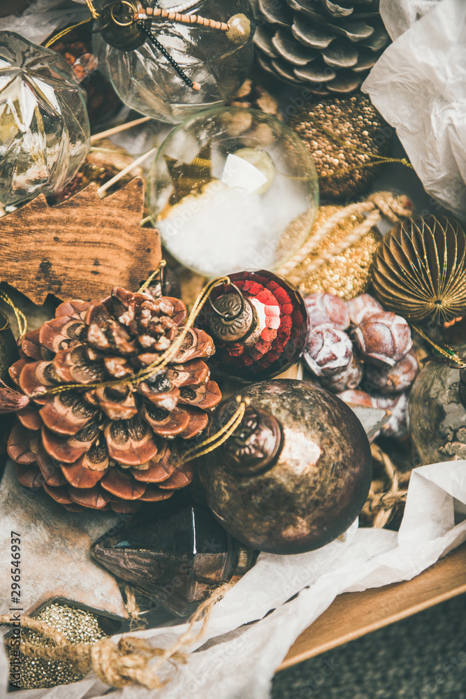 Christmas or New Year preparations. Various vintage Christmas tree decoration toys and pine cones in