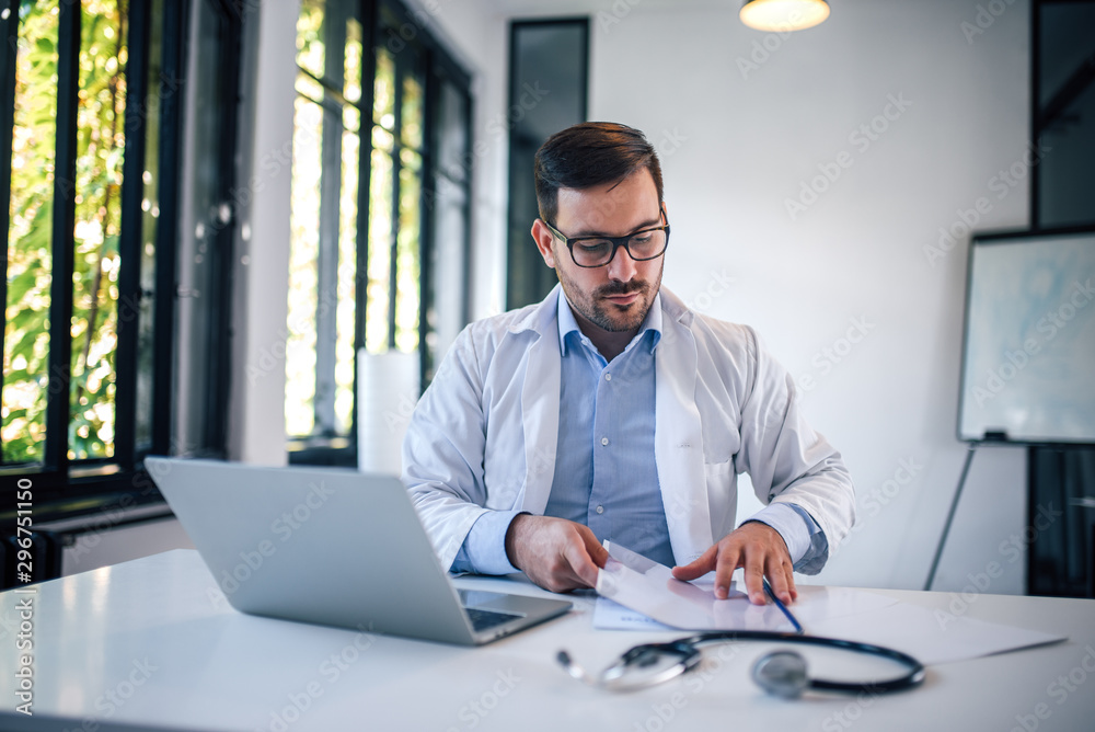 Doctor concentrate on reading for medical research, portrait.