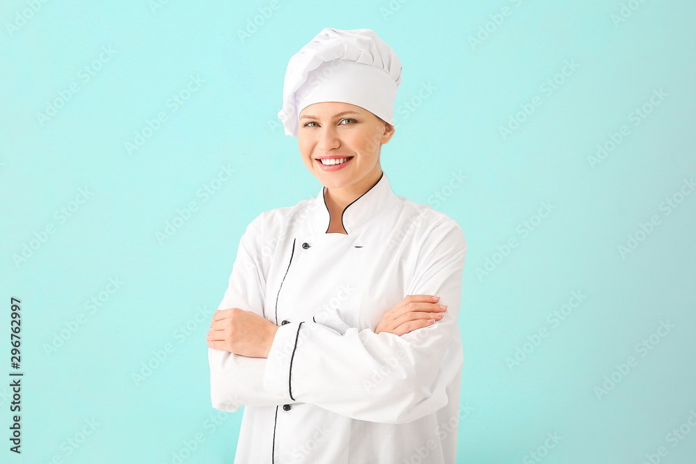 Beautiful female chef on light background