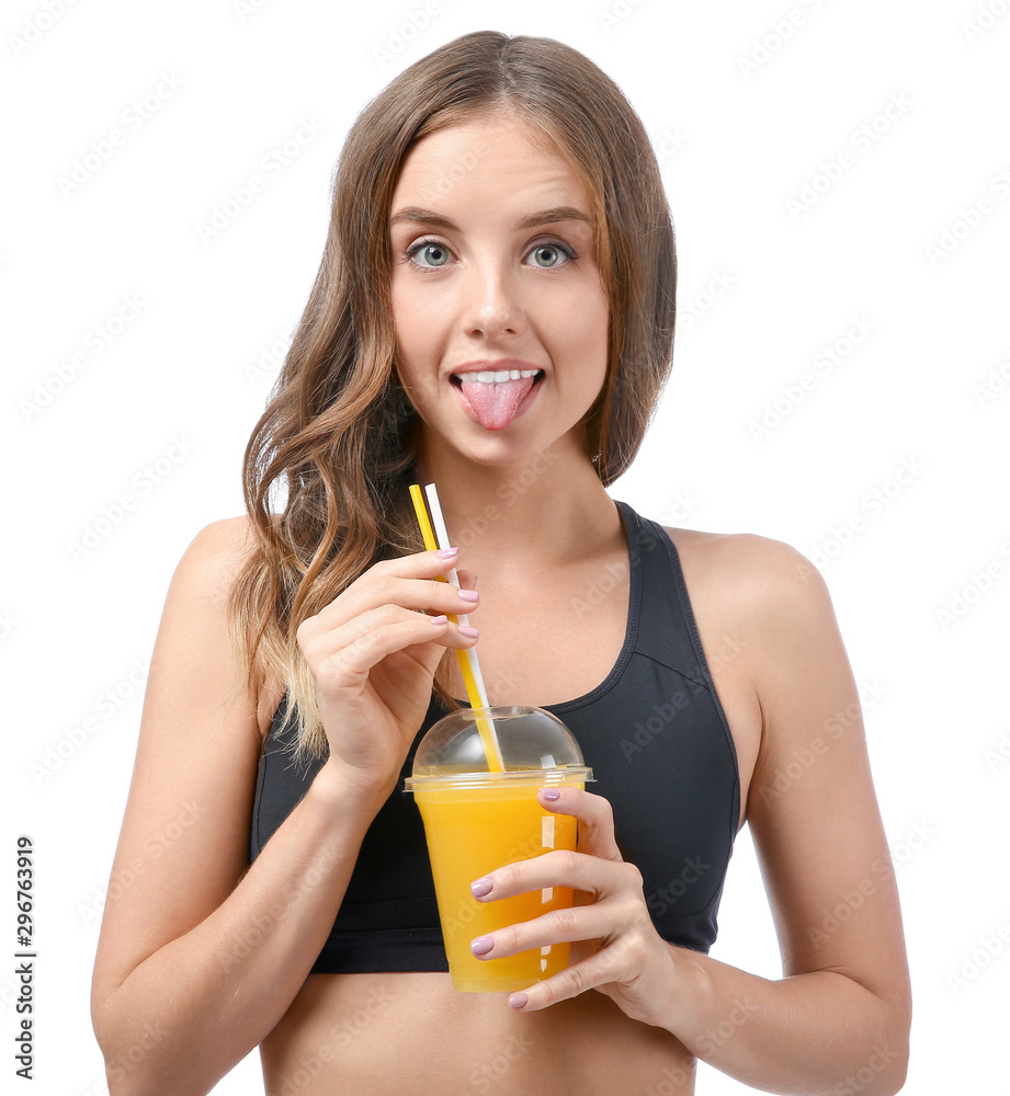 Beautiful young woman with orange juice on white background