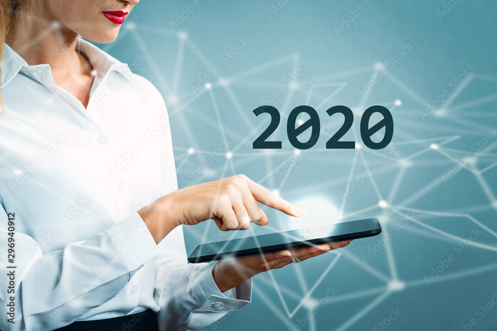 2020 text with business woman using a tablet