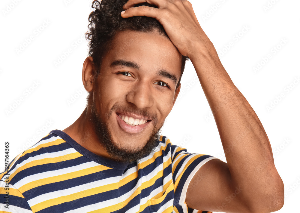 Portrait of happy African-American man on white background