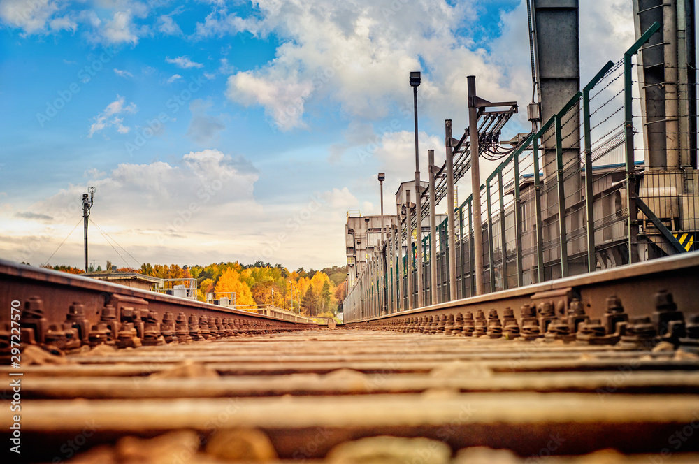 Old rusty railroad in perpective in autumn