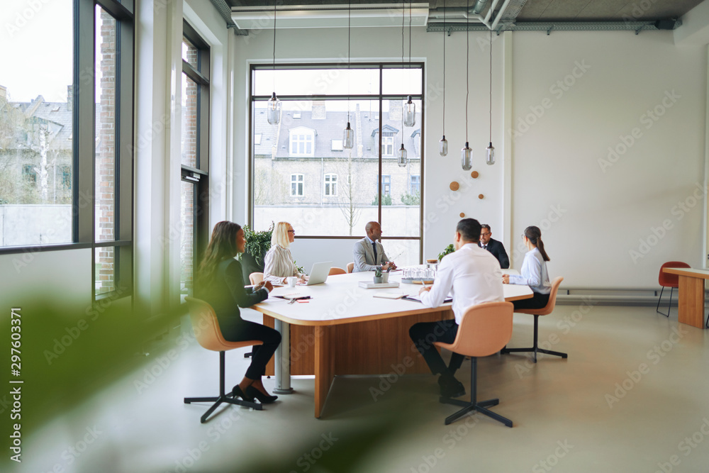 Diverse group of businesspeople having a boardroom meeting toget