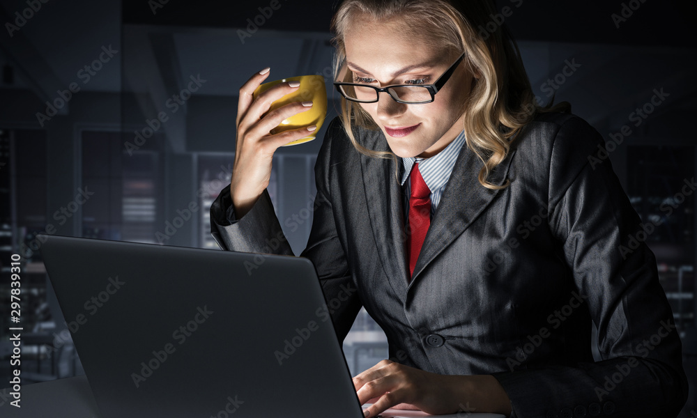 Young businesswoman sitting at desk