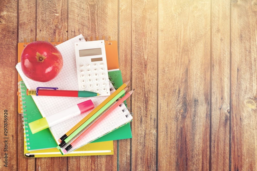 School supplies with an apple on top - isolated image