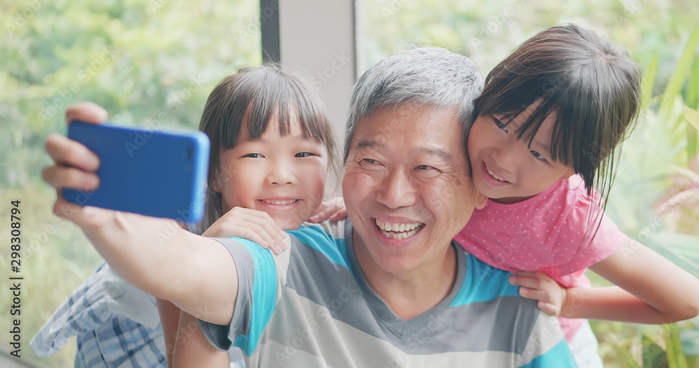 grandfather take selfie with kids