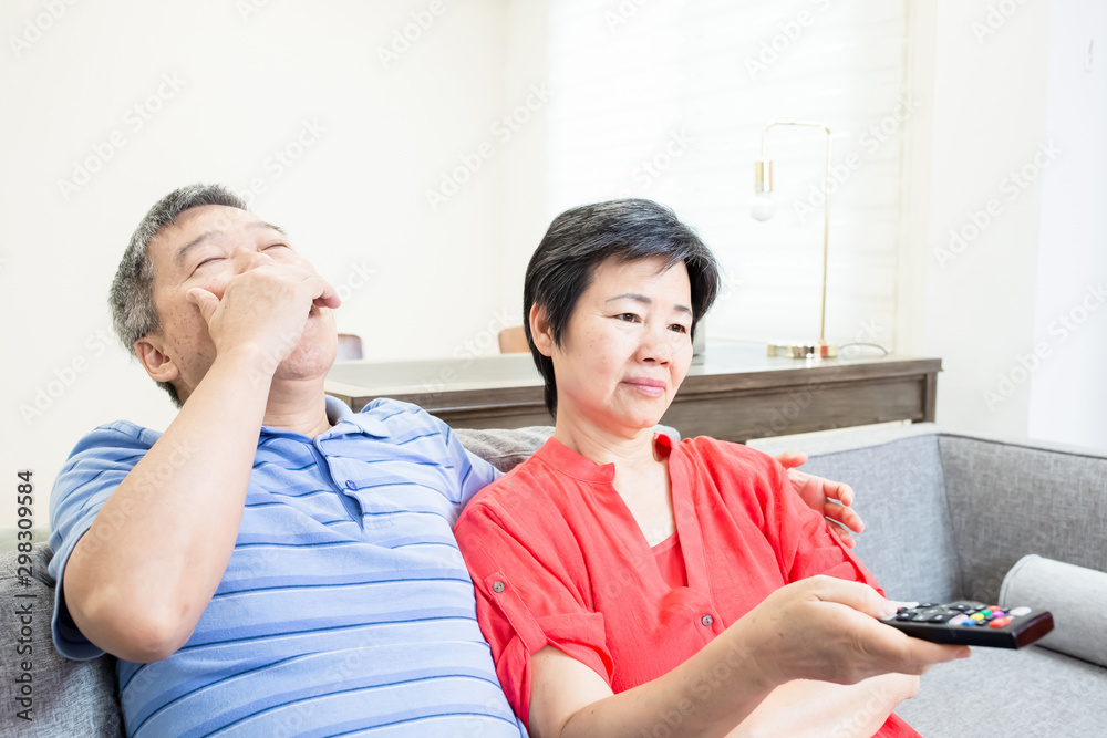 eldely couple watch tv