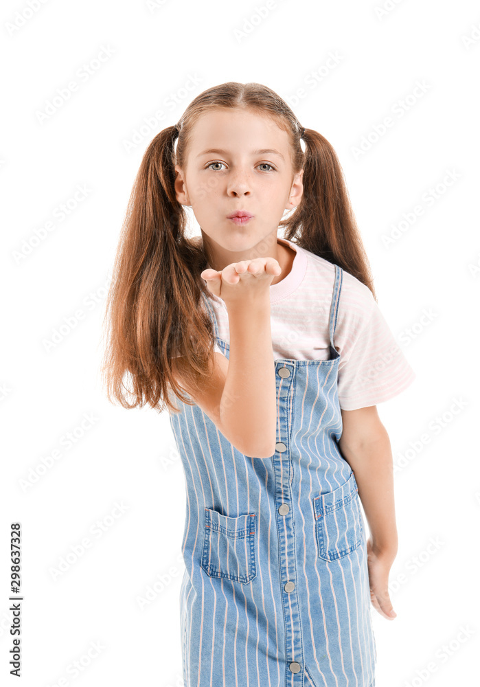 Cute little girl blowing kiss on white background