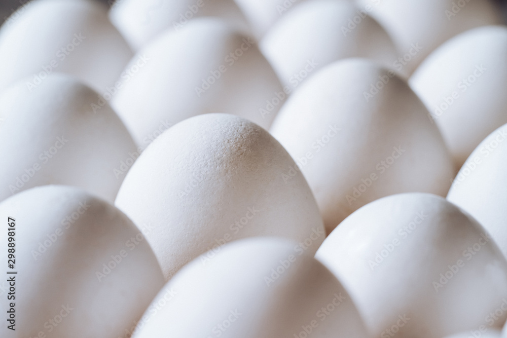 Chicken white eggs closeup. Farm products and natural eggs. Healthy food.