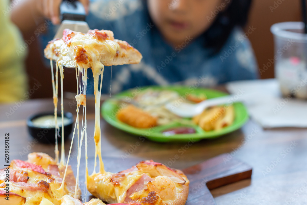 Seafood Italian Pizza slice on wood dish