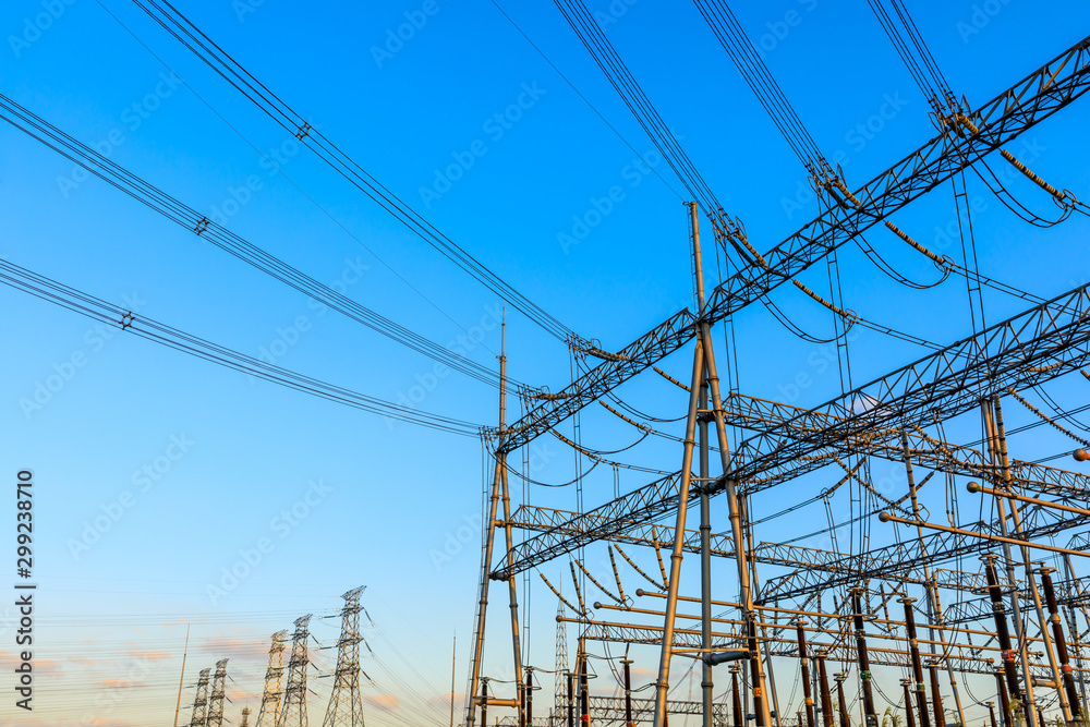 High voltage electricity tower at sunset.substation industrial background.