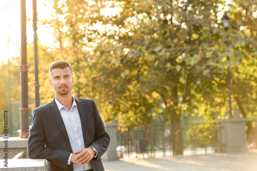 Portrait of handsome businessman outdoors