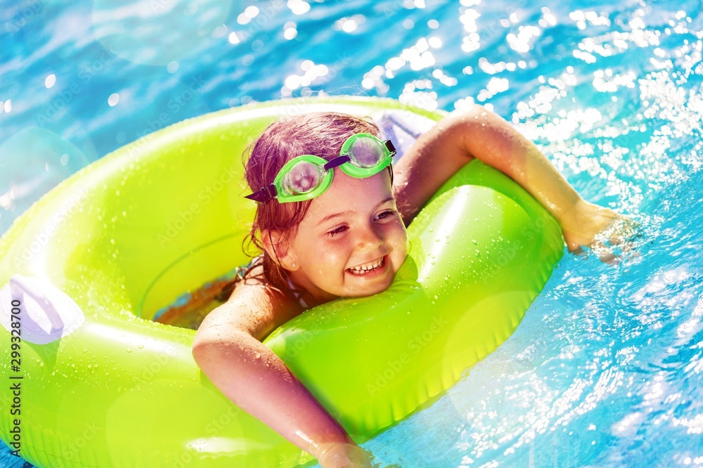 Children playing in pool. Two little girls