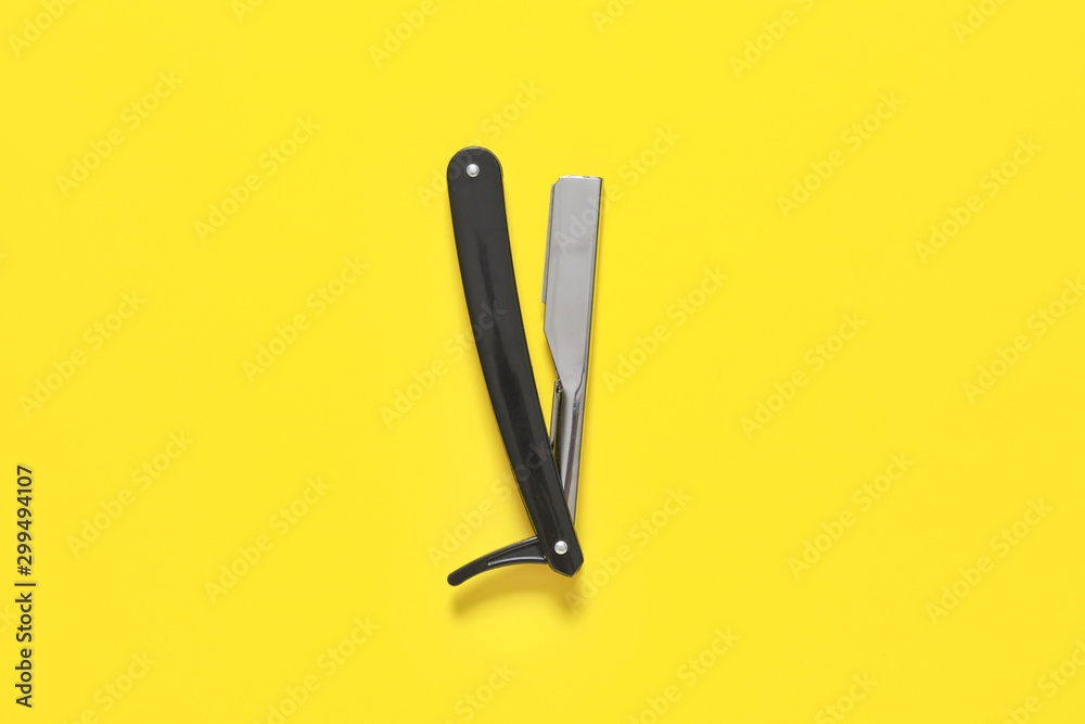 Shaving razor on color background