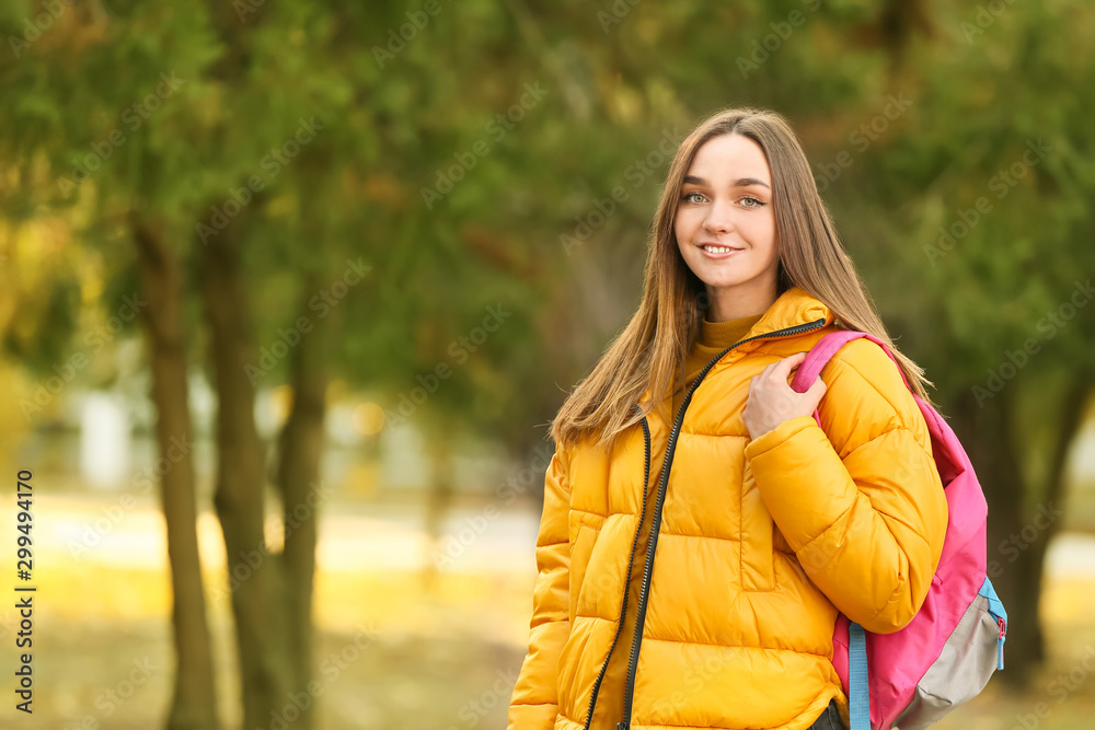 Portrait of teenage female student outdoors