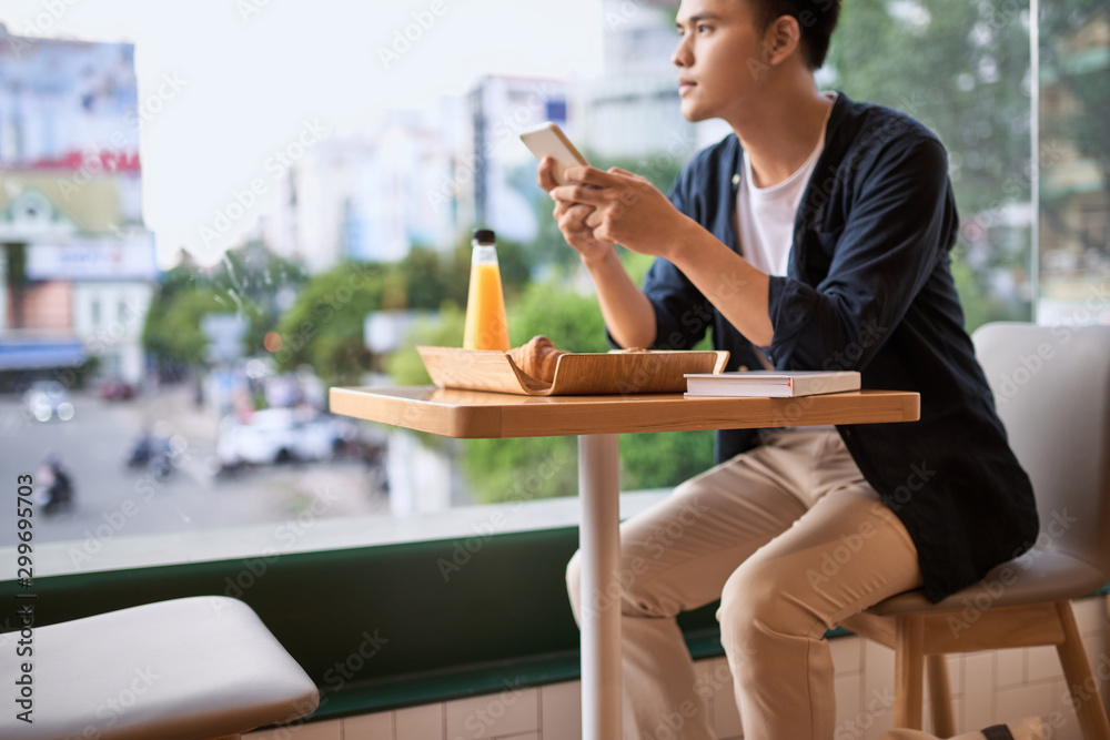 Men use phone on tea time,using mobile smart phone, Internet of things lifestyle with wireless commu