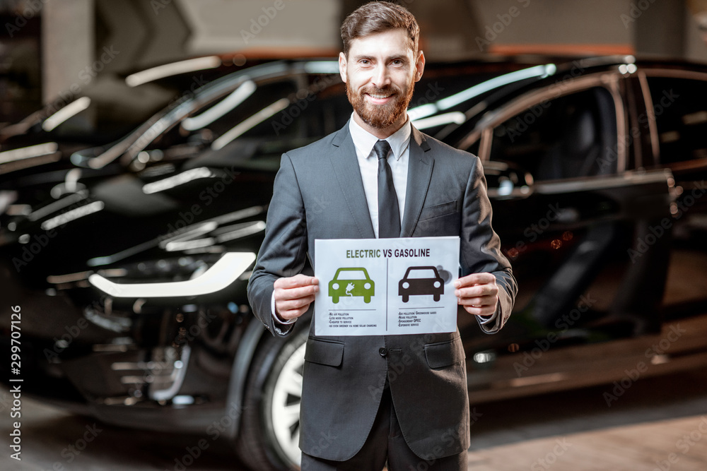 Sales consultant with a drawing on the topic of eco-friendly electric cars