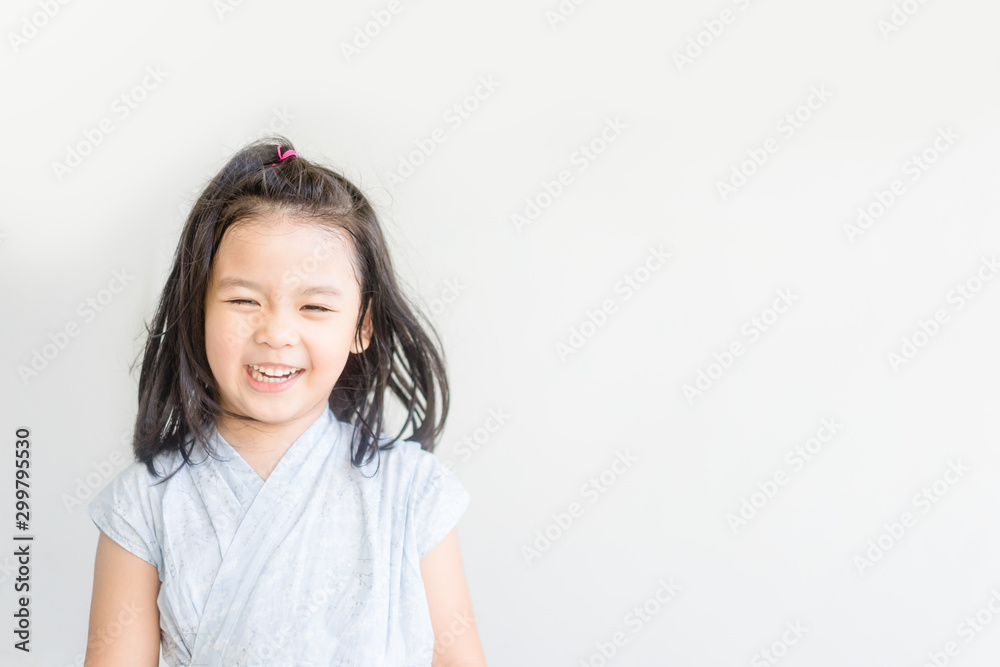 Little Asian child girl in japanese tradition dress ready for onsen in Tokyo Japan.Happy smiley face