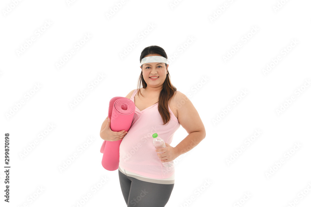 Overweight Asian woman with exercise mat isolated on white background