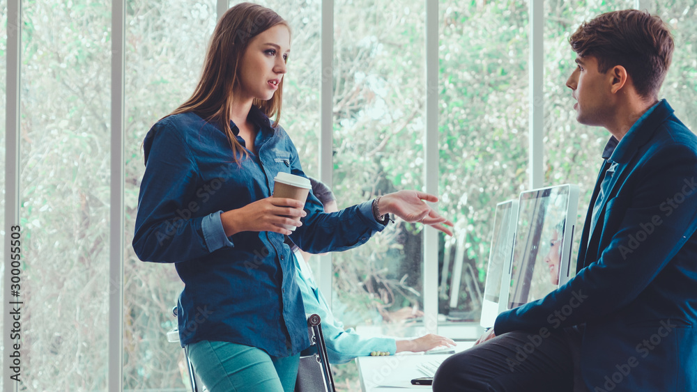 Happy businesswoman and businessman having conversation in modern office. Business corporate and com