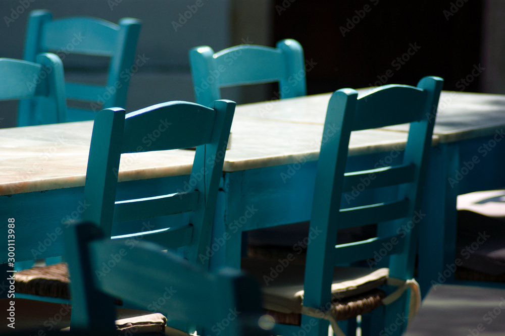 A close up detailed view of traditional wooden taverna furniture.  Simple traditional design that co