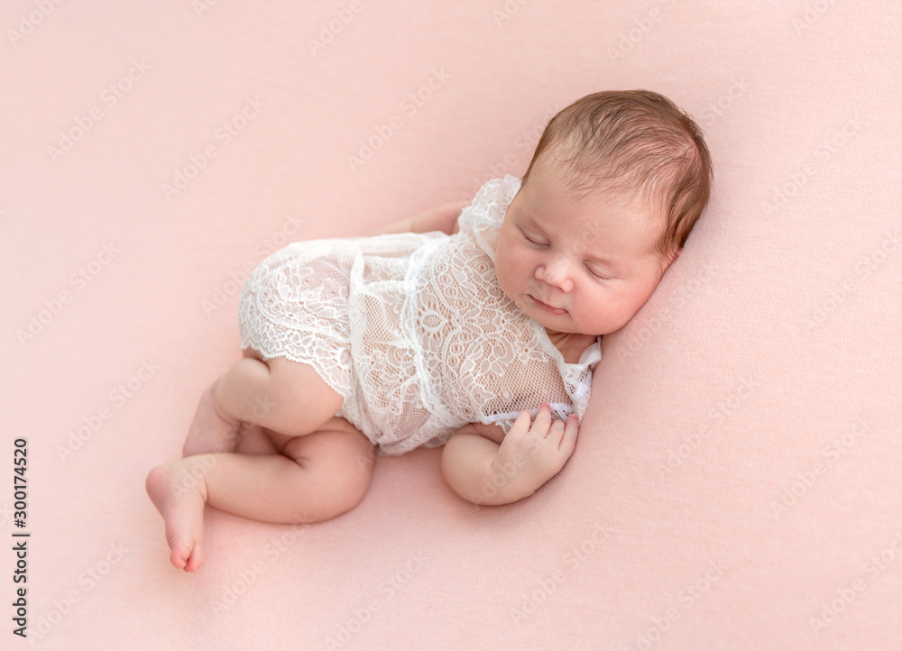 newborn baby sleeping on a little pillow