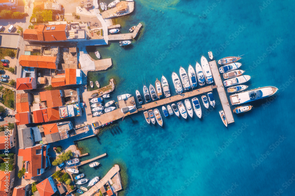 Aerial view of boats and yachts in port in old city at sunset. Summer landscape with buildings with 