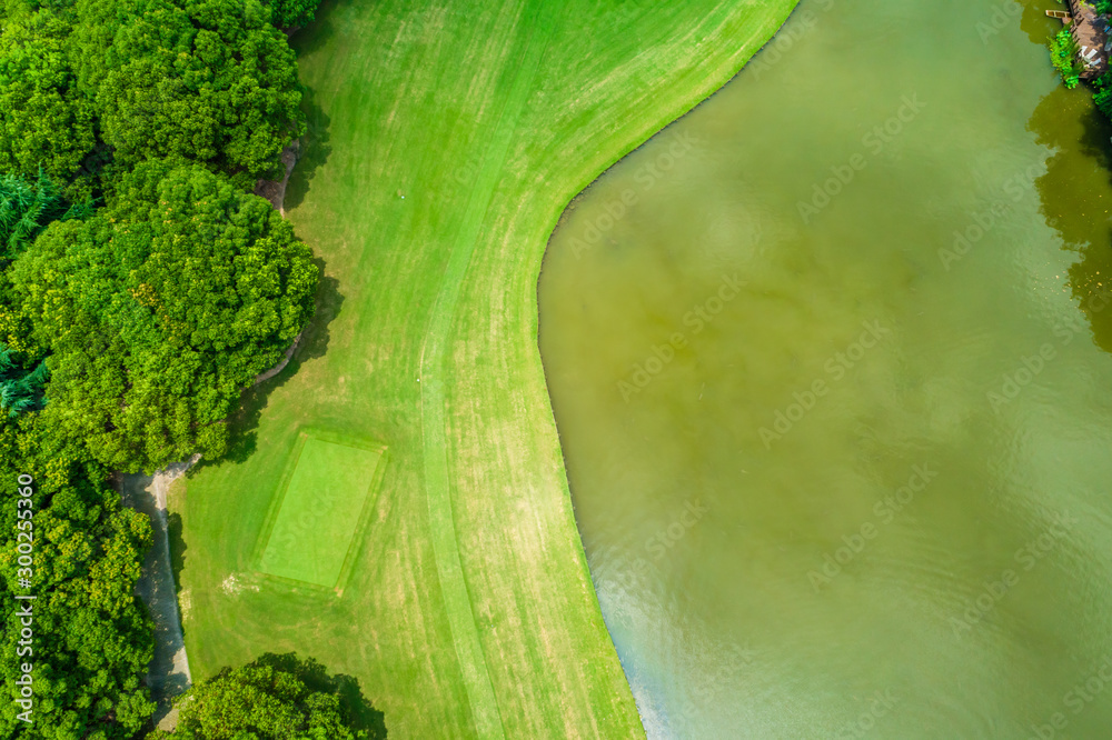 Aerial view of golf course and water