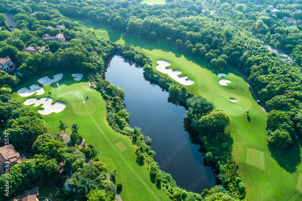 Aerial view of golf course and water