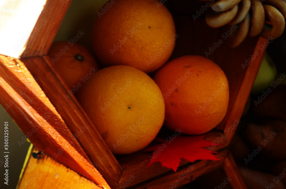 Fruits on a plate on a wooden shelf