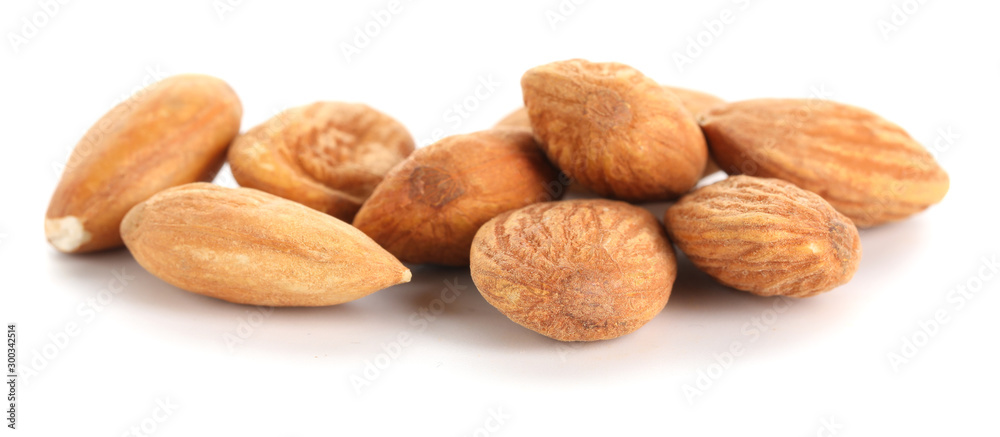 Tasty almonds on white background