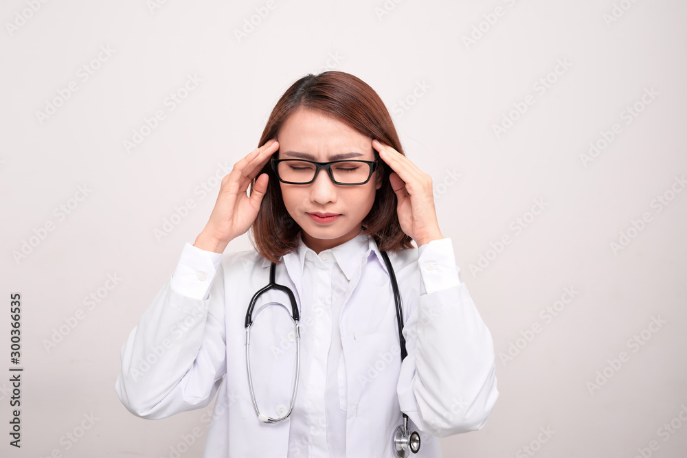 medical doctor woman with stethoscope problem, hold hand head on white background